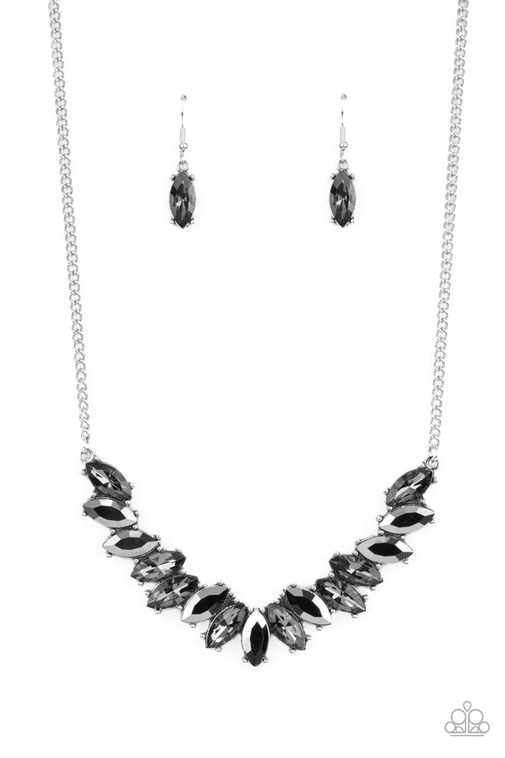 Featuring pronged silver fittings, a sparkly series of smoky and hematite marquise cut rhinestones fan out below the collar for a stellar statement-making look. Features an adjustable clasp closure.  Sold as one individual necklace. Includes one pair of matching earrings.
