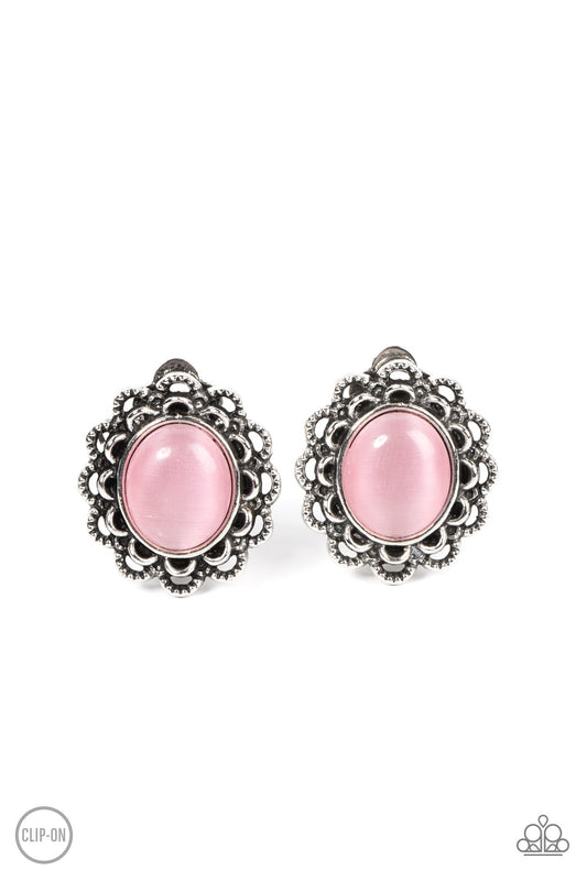 Folds of textured silver petals gather around an oval Pale Rosette cat's eye stone, blooming into an ethereal floral centerpiece. Earring attaches to a standard clip-on fitting.  Sold as one pair of clip-on earrings.