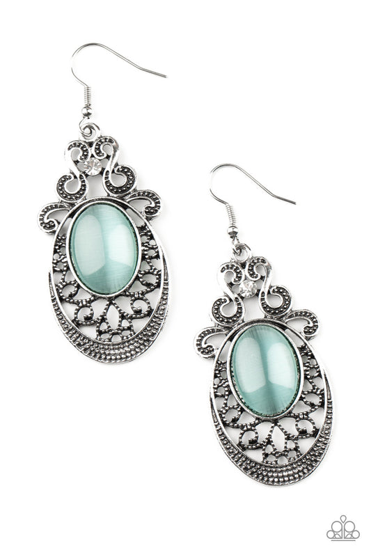 Topped with studded silver filigree and a solitaire white rhinestone, an oval silver frame is adorned with studded vine-like filigree that fans out from the bottom of a whimsical blue cat eye's stone for an enchanted fashion. Earring attaches to a standard fishhook fitting.  Sold as one pair of earrings.