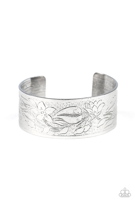 A tangle of flowering vines bloom across the front of a thick silver cuff, creating a whimsical centerpiece.  Sold as one individual bracelet.