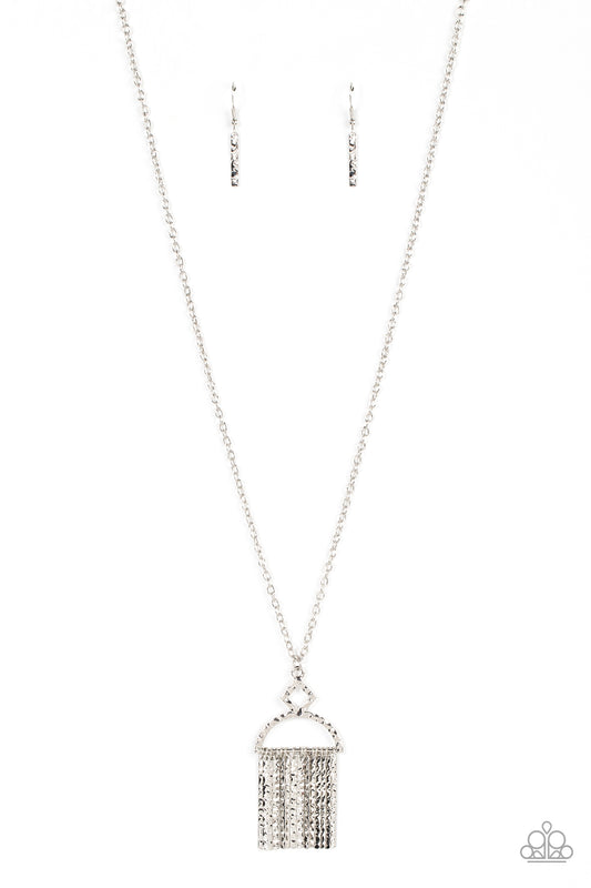 A silvery fringe of hammered pendulums swings from the bottom of a hammered geometric pendant. The half moon-like pendant swings from the bottom of an extended silver chain, creating a noisemaking tassel. Features an adjustable clasp closure.  Sold as one individual necklace. Includes one pair of matching earrings.