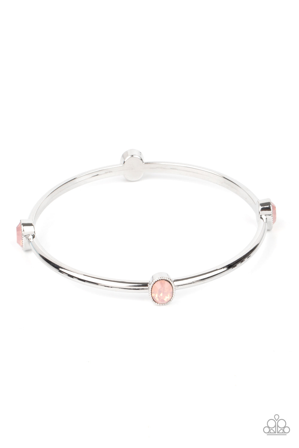 Pink oval opal rhinestones embellish a dainty silver bangle, creating an enchanted shimmer around the wrist.  Sold as one individual bracelet.