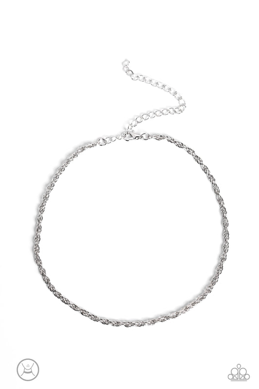 An ornate silver rope chain links around the neck, resulting in an edgy minimalist inspired grit. Features an adjustable clasp closure.  Sold as one individual choker necklace. Includes one pair of matching earrings.