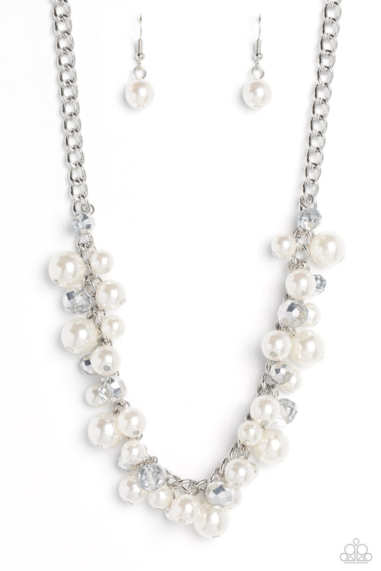A faceted collection of glassy, silver crystal-like beads and classic white pearls in varying sizes flickers and flashes below the collar on a thick silver curb chain for a refined shimmer. Features an adjustable clasp closure.  Sold as one individual necklace. Includes one pair of matching earrings.