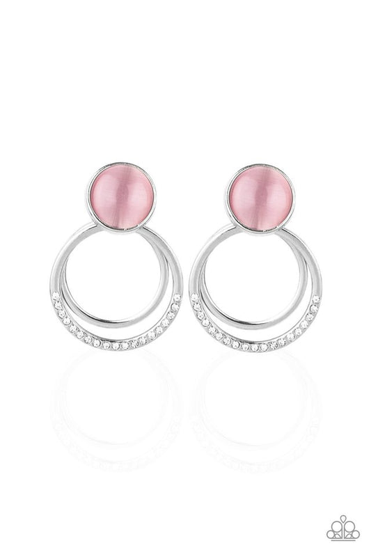 A plain silver hoop and white rhinestone encrusted hoop swing from the bottom of a glowing pink cat's eye stone fitting for a whimsical fashion. Earring attaches to a standard post fitting.  Sold as one pair of post earrings.
