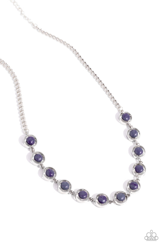 A dainty series of serrated silver rings are fitted with pronged gray beaded centers as they delicately link below the collar from a classic silver chain, resulting in a seasonal statement. Features an adjustable clasp closure.  Sold as one individual necklace. Includes one pair of matching earrings.