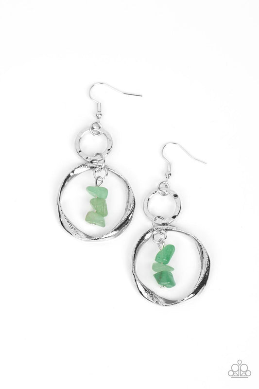 A warped silver hoop links with a hammered silver hoop, interlocking into a rustic lure. Threaded along a metal rod, jade pebbles trickle from the top of the lowermost hoop for a tranquil finish. Earring attaches to a standard fishhook fitting.  Sold as one pair of earrings.