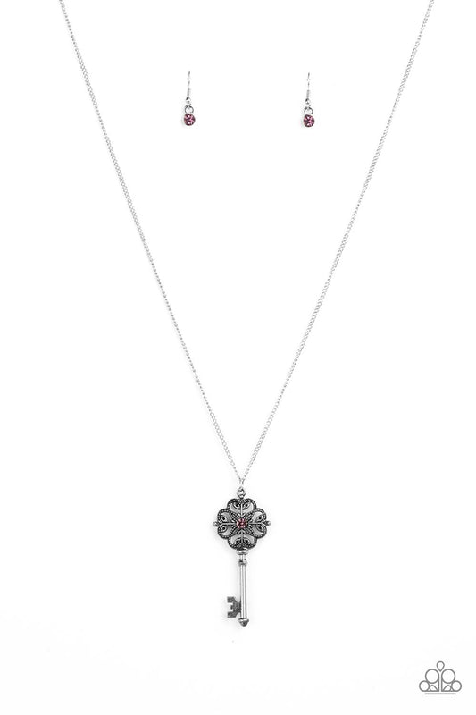 Dotted with a glittery purple rhinestone, a vintage inspired key pendant swings from the bottom of an elegantly elongated silver chain for a whimsical look. Features an adjustable clasp closure.  Sold as one individual necklace. Includes one pair of matching earrings.