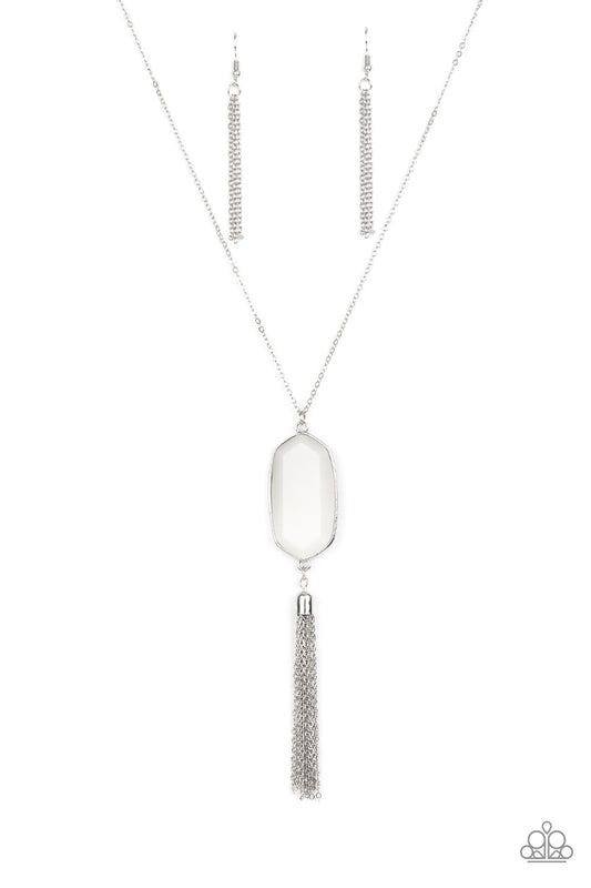 Featuring a faceted surface, a dewy white acrylic gem swings from the bottom of a lengthened silver chain. A shimmery silver chain tassel attaches to the bottom of the colorful pendant, adding flirtatious movement. Features an adjustable clasp closure.  Sold as one individual necklace. Includes one pair of matching earrings.