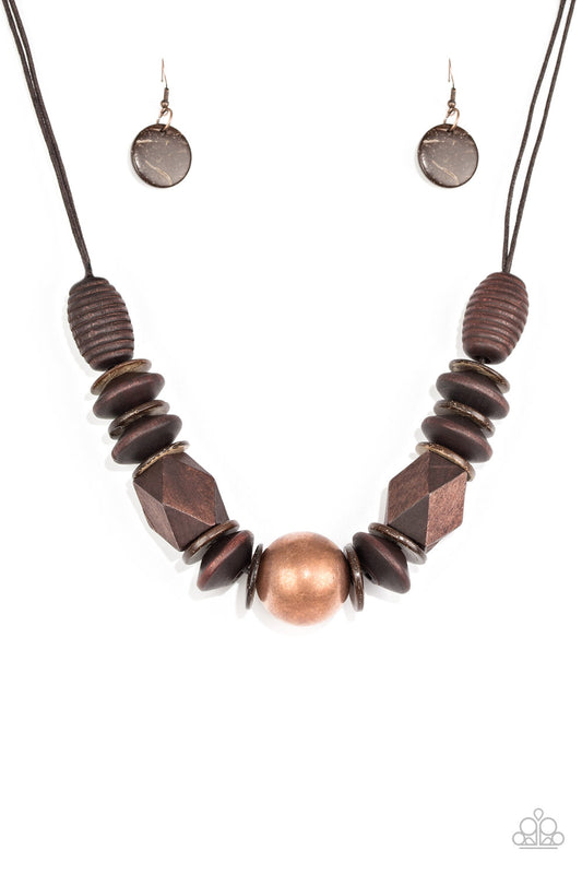 Featuring abstract geometric finishes, mismatched brown wooden beads are threaded along shiny brown cording. A dramatic copper bead adorns the center, creating a bold seasonal look below the collar. Features a button loop closure.  Sold as one individual necklace. Includes one pair of matching earrings.