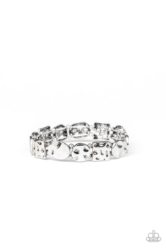 Infused with dainty silver beads, an asymmetrical collection of hammered square and round silver frames are threaded along stretchy bands around the wrist for a simple artisan inspired look.

Sold as one individual bracelet.