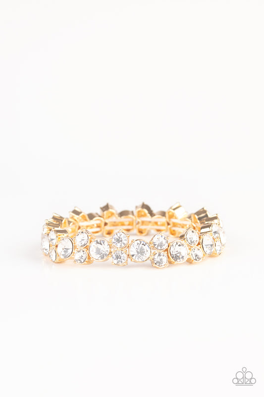 Featuring sleek gold frames, trios of glittery white rhinestones are threaded along stretchy bands around the wrist for a timeless shimmer.

Sold as one individual bracelet.