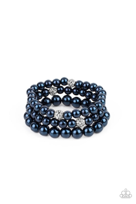 Infused with white rhinestone encrusted silver beads, a bubbly collection of mismatched blue pearls are threaded along stretchy bands around the wrist for a vintage inspired layered look.  Sold as one set of three bracelets.