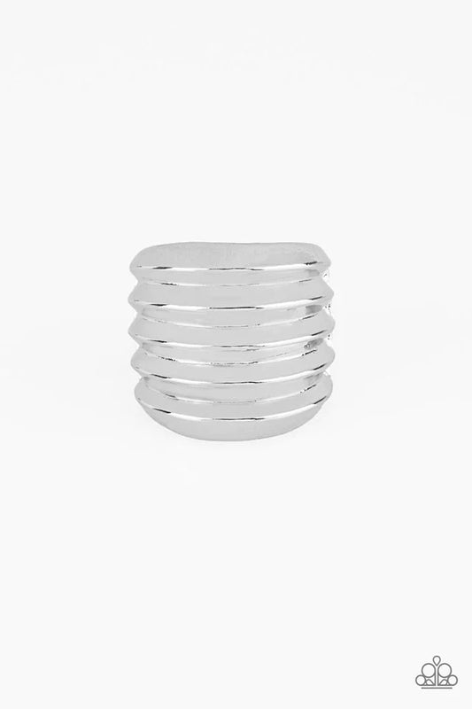 Rippling silver bands coalesce into a thick frame around the finger for a dramatic industrial look. Features a stretchy band for a flexible fit.  Sold as one individual ring.