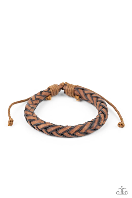 Featuring rustic edges, braided brown leather laces delicately spin into a boldly woven band around the wrist. Features an adjustable sliding knot closure.  Sold as one individual bracelet.