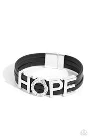 Threaded along layers of black leather strands, glistening silver letters form the word "HOPE" with the "O" embossed in white rhinestones for a dazzling statement. Features a magnetic closure.  Sold as one individual bracelet.