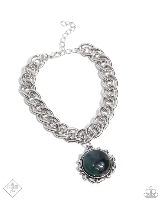 Set in a silver sun-bordered frame, a round green marbled stone radiates from a thick silver chain around the wrist for a celestially chic look. Features an adjustable clasp closure. As the stone elements in this piece are natural, some color variation is normal.