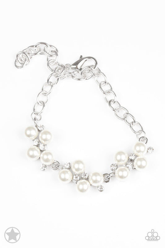 Cascading from a classic silver chain, clusters of shimmery white pearls and sparkling dainty, white rhinestones connect along the wrist, creating a vintage, timeless statement. Features an adjustable clasp closure.  Sold as one individual bracelet.