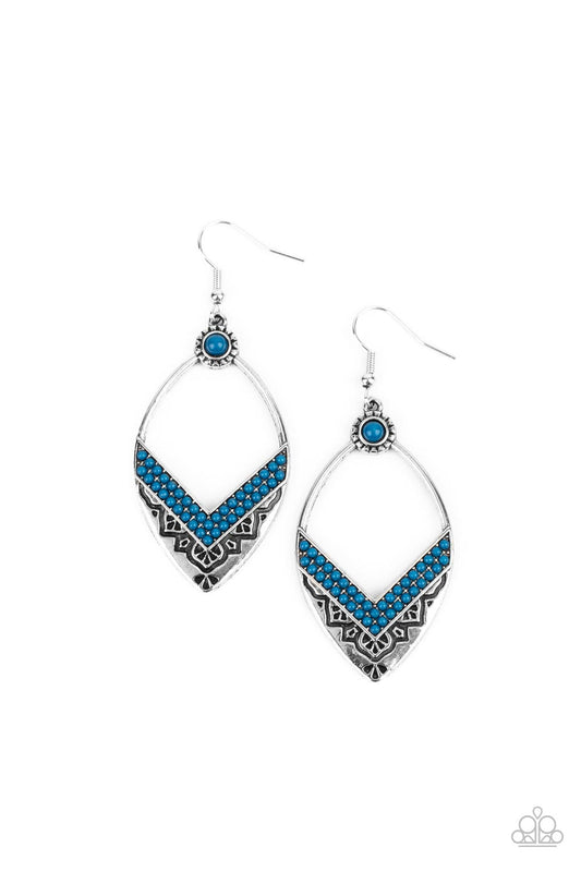 Two rows of Mykonos Blue seed beads create a V at the bottom of an airy silver frame embossed and stamped in indigenous inspired patterns. A matching Mykonos Blue seed bead adorns the top of the frame, adding additional color to the seasonal display. Earring attaches to a standard fishhook fitting.  Sold as one pair of earrings.