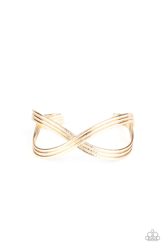Delicately hammered in endless shimmer, shiny gold bars delicately crisscross over and around the wrist, coalescing into an infinity inspired cuff.  Sold as one individual bracelet.