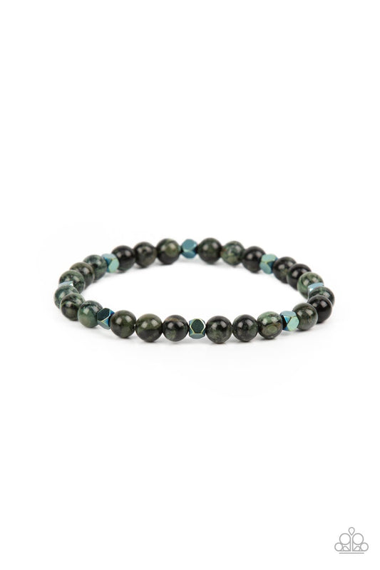 A dainty collection of speckled green stone beads and faceted metallic cube beads are threaded along a stretchy band around the wrist for an earthy flair.  Sold as one individual bracelet.