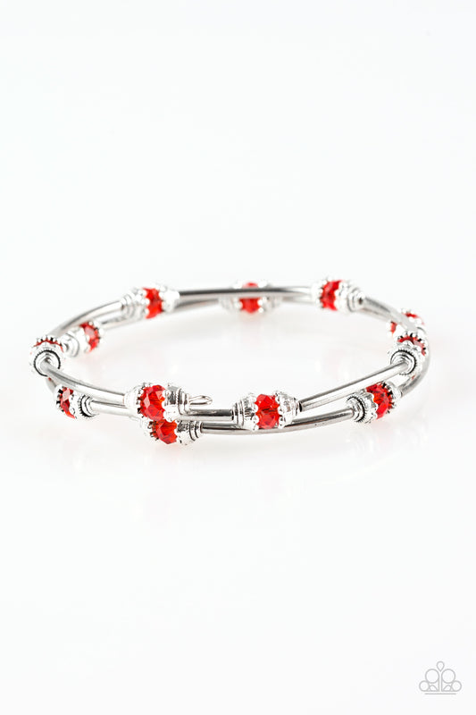 Dainty red crystal-like beads and shimmery silver accents alternate along a coiled wire to create a refined infinity wrap style bracelet.  Sold as one individual bracelet.