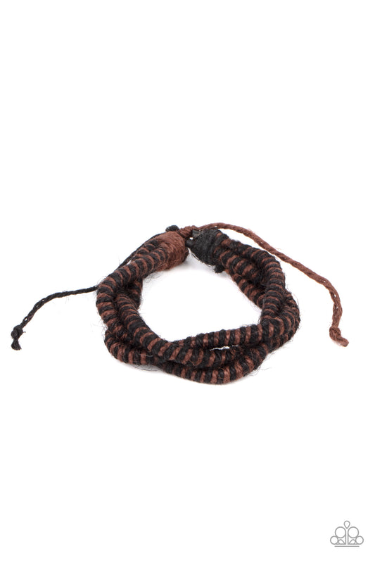 Featuring a distressed finish, black and brown spun cording weaves across the wrist for a rugged earthy look. Features an adjustable sliding knot closure.  Sold as one individual bracelet.