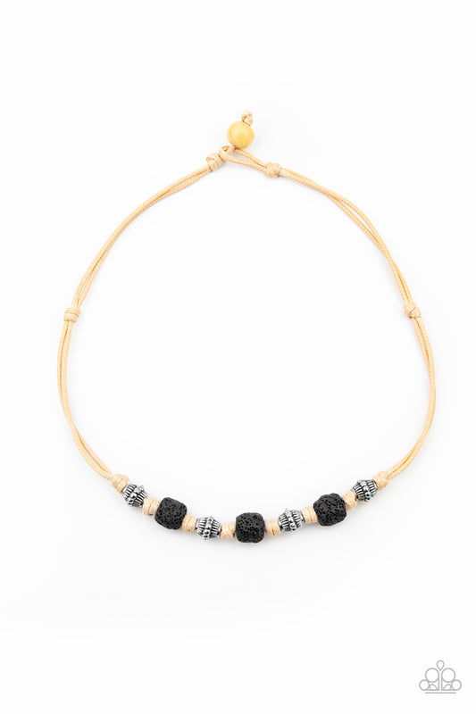 Decorative silver beads and pieces of black pumice-like rock are knotted in place below the collar for a seasonal look. Features a button loop closure.  Sold as one individual necklace.
