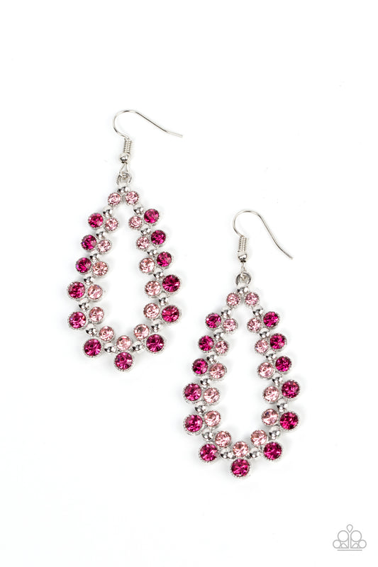A glitzy collection of fuchsia and baby pink rhinestones flank a studded silver teardrop frame, resulting in a glamorous lure. Earring attaches to a standard fishhook fitting.

Sold as one pair of earrings.