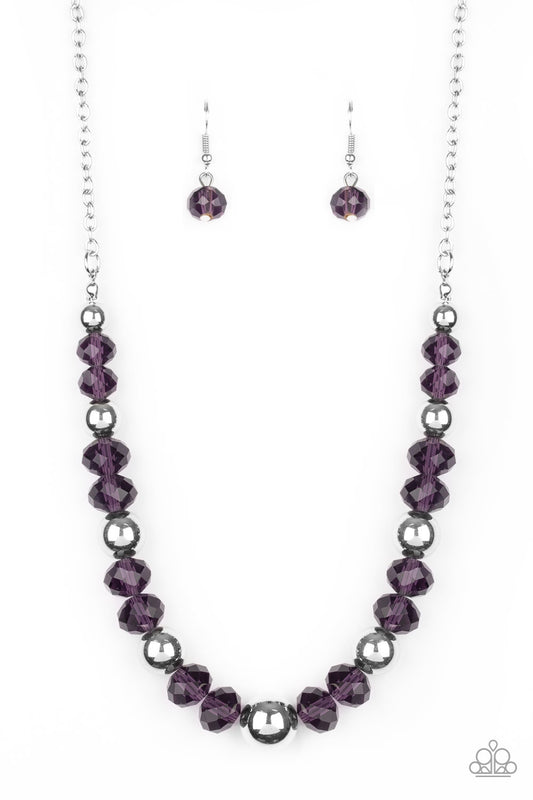 A glittery collection of purple crystal-like beads and shiny silver beads are threaded along an invisible wire below the collar for a refined flair. Features an adjustable clasp closure.  Sold as one individual necklace. Includes one pair of matching earrings.