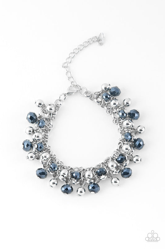 Dipped in a metallic shimmer, faceted blue beads and classic silver beads swing from interlocking silver chains, creating a refined fringe around the wrist. Features an adjustable clasp closure.

Sold as one individual bracelet.