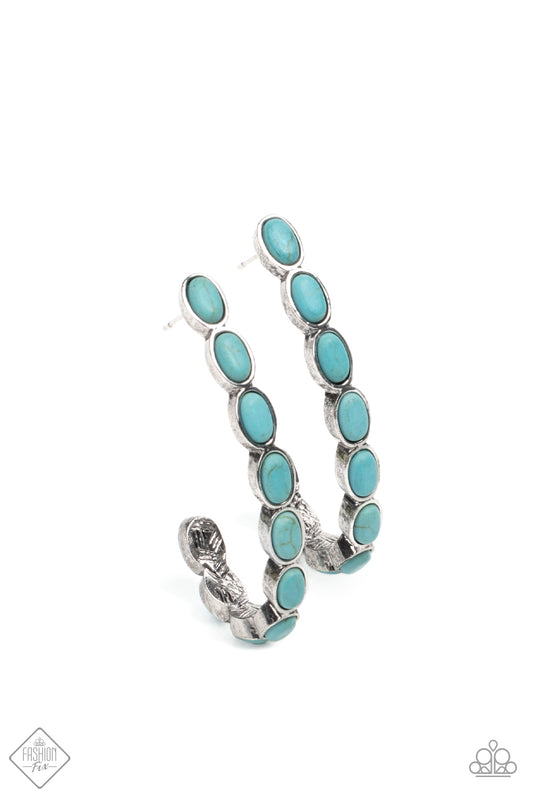 Small turquoise stones pressed into simple silver oval frames stack end to end as they fall from the ear and delicately curve into a J-shaped hoop for a refreshing finish. Earring attaches to a standard post fitting. Hoop measures approximately 1" in diameter.  Sold as one pair of hoop earrings.