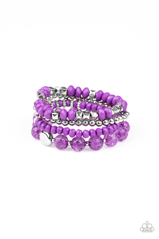 A mismatched assortment of silver, purple, and crackling purple glass-like beads are threaded along stretchy band around the wrist, creating colorful layers.  Sold as one set of four bracelets.
