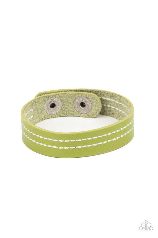 The front of a dainty green leather band is stitched in two linear rows, creating a colorfully rustic centerpiece around the wrist. Features an adjustable snap closure.  Sold as one individual bracelet.