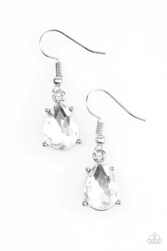 Featuring a regal teardrop cut, a glittery white rhinestone is pressed into a sleek silver frame, creating an edgy shimmer. Earring attaches to a standard fish hook setting.  Sold as one pair of earrings.