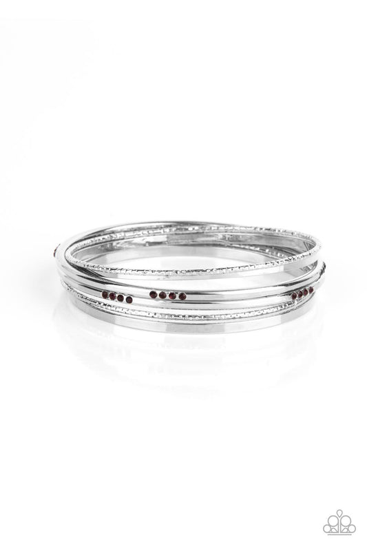 Encrusted in sections of glittery purple rhinestones, a mismatched collection of sparkly, smooth, and textured silver bangles stylishly stack up the wrist for a standout look.  Sold as one set of six bracelets.