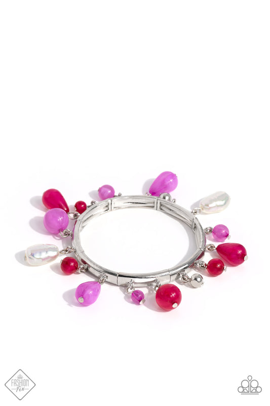 Cloudy Radiant Orchid and Viva Magenta beads, silver beads, and iridescent-dipped baroque pearls elegantly drip along silver frames stretched together on elastic stretchy bands around the wrist, creating a whimsically-clustered display. Due to its prismatic palette, color may vary.  Sold as one individual bracelet.
