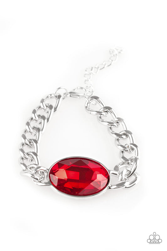 An oversized red gem attaches to a bold silver chain, creating a dramatic centerpiece atop the wrist. Features an adjustable clasp closure.

Sold as one individual bracelet.