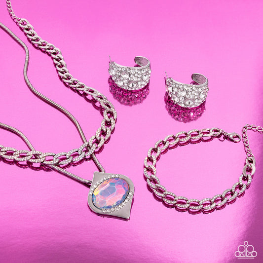 Women's silver chain necklace, silver rope chain with multi colored rhinestone pendant and smaller white rhinestones above and below rhinestone, silver chain bracelet, small silver wide hoop earrings with white rhinestones of varying sizes