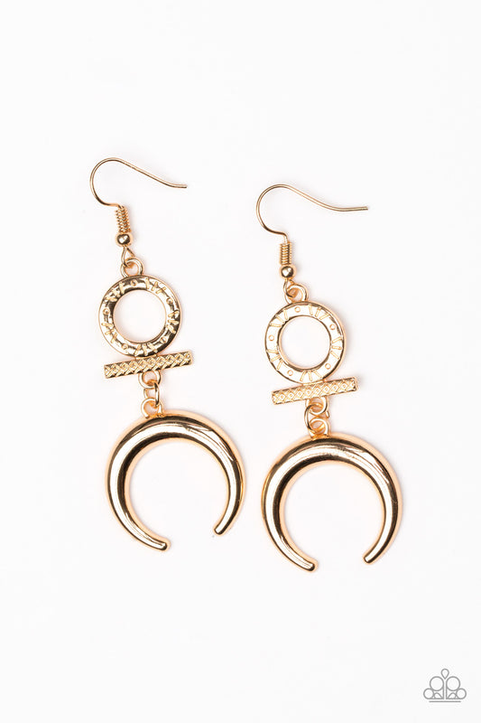 A shimmery brass crescent swings from the bottom of delicately stacked brass frames radiating with geometric patterns for a tribal inspired look. Earring attaches to a standard fishhook fitting.  Sold as one pair of earrings.