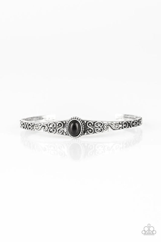 Infused with an earthy black stone center, a dainty silver cuff has been embossed in swirling antiqued detail for a seasonal look.  Sold as one individual bracelet.