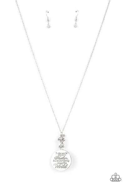 A silver disc inscribed with the phrase, "To the world you are a Mother, but to your family you are the World," creates a sweet reminder as it falls from a lengthened silver chain. A sprinkle of dainty white opals and silver beads adds a decorative fringe atop the memento. Features an adjustable clasp closure.  Sold as one individual necklace. Includes one pair of matching earrings.