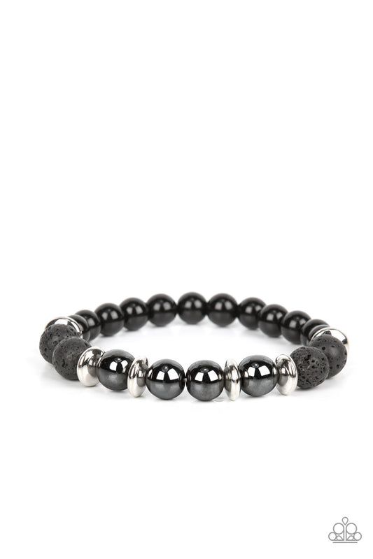 Infused with a section of polished black beads, a stellar assortment of gunmetal beads, silver accents, and black lava rock beads are threaded along stretchy bands around the wrist for an urban flair.  Sold as one individual bracelet.