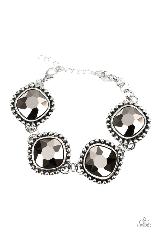 Featuring dramatically studded silver frames, an exaggerated display of oversized hematite rhinestone encrusted frames delicately link around the wrist for a blinding look. Features an adjustable clasp closure.

Sold as one individual bracelet.