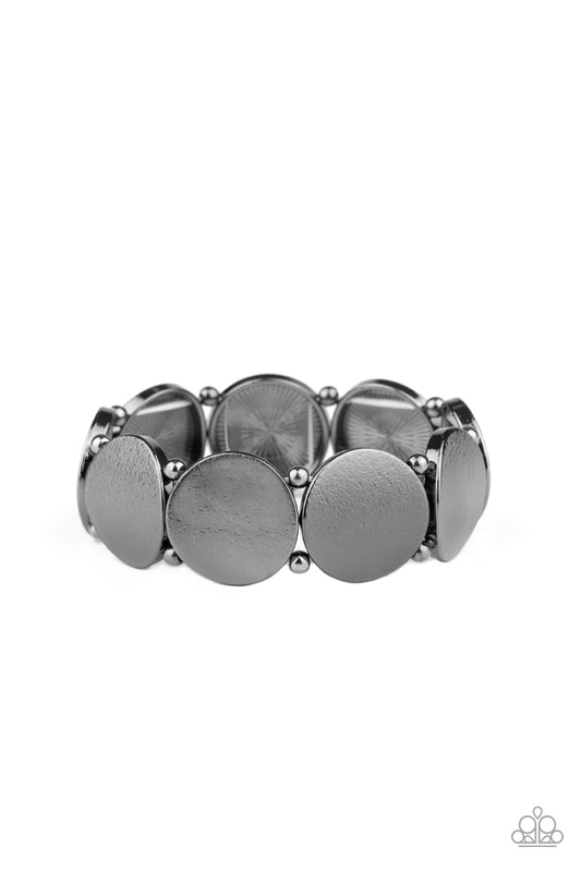 Infused with pairs of dainty gunmetal beads, delicately hammered gunmetal discs slide along a stretchy band around the wrist for a hint of industrial flavor.

Sold as one individual bracelet.