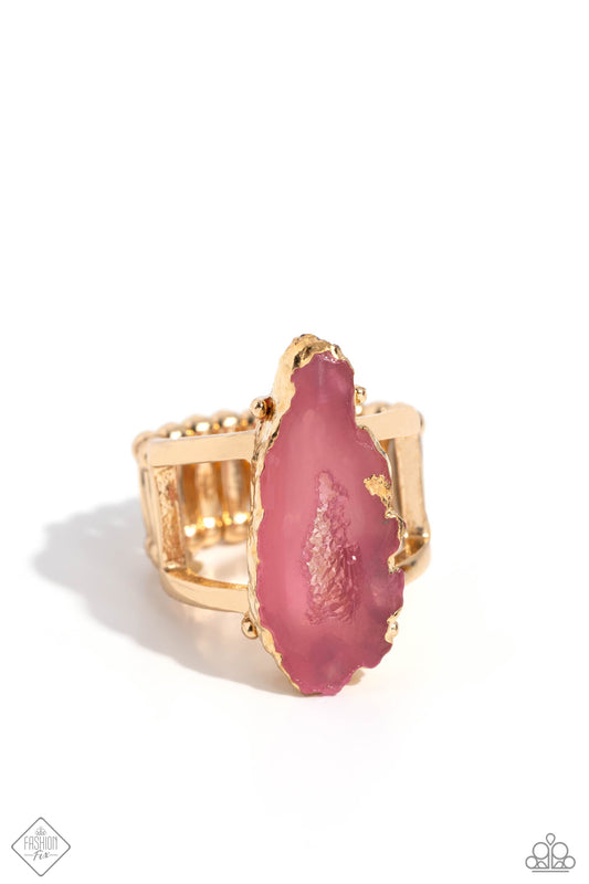 Featured atop airy gold bands, a pink geode stone with druzy-like accents is encased in gold foiling for a decadently earthy centerpiece atop the finger. Features a stretchy band for a flexible fit. As the stone elements in this piece are natural, some color variation is normal.  Sold as one individual ring.