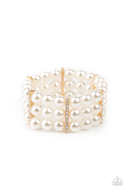 Held together by white rhinestone dotted gold fittings, row after row of bubbly white pearls are threaded along stretchy bands around the wrist for a timeless elegance.  Sold as one individual bracelet.