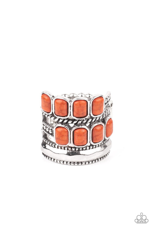 Mismatched rows of Adobe rectangular stone beads, twisted silver and studded silver bars, and a faceted silver band haphazardly layer across the finger, coalescing into a colorfully rustic centerpiece. Features a stretchy band for a flexible fit.  Sold as one individual ring. Fashion Fabulous Jewelry