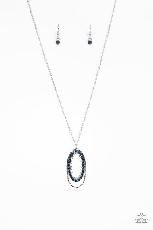 Ringed in a studded silver frame, glittery blue and white rhinestones collect into a glamorous pendant at the bottom of a lengthened silver chain for a refined flair. Features an adjustable clasp closure.  Sold as one individual necklace. Includes one pair of matching earrings.