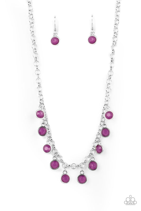 Featuring a milky shimmer, opaque Dahlia crystal-like beads are pressed into simple silver settings as they dance below the collar for a colorfully carefree look. Features an adjustable clasp closure.  Sold as one individual necklace. Includes one pair of matching earrings.